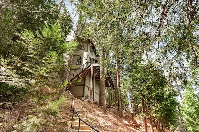 view of property exterior featuring stairway