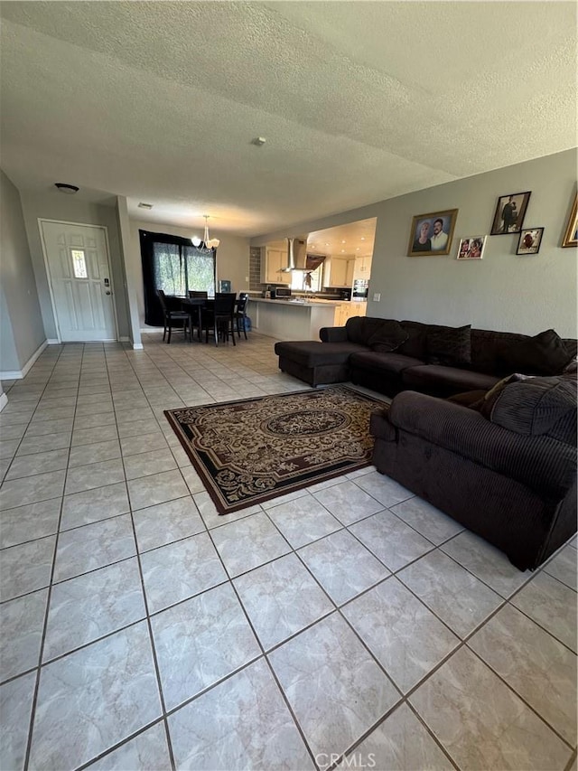 17665 Juniper St, Hesperia, CA 92345 - living area with a chandelier, light tile patterned floors, and a textured ceiling