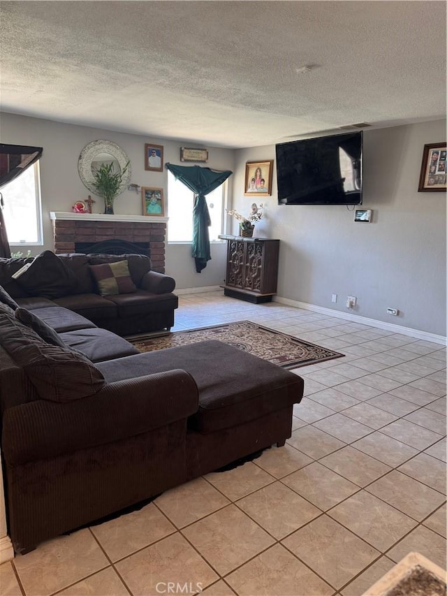 17665 Juniper St, Hesperia, CA 92345 - living room featuring a textured ceiling, light tile patterned floors, baseboards, and a brick fireplace