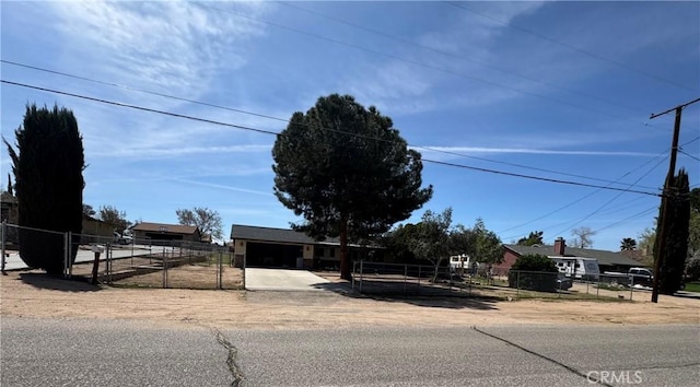 17665 Juniper St, Hesperia, CA 92345 - obstructed view of property with concrete driveway and fence