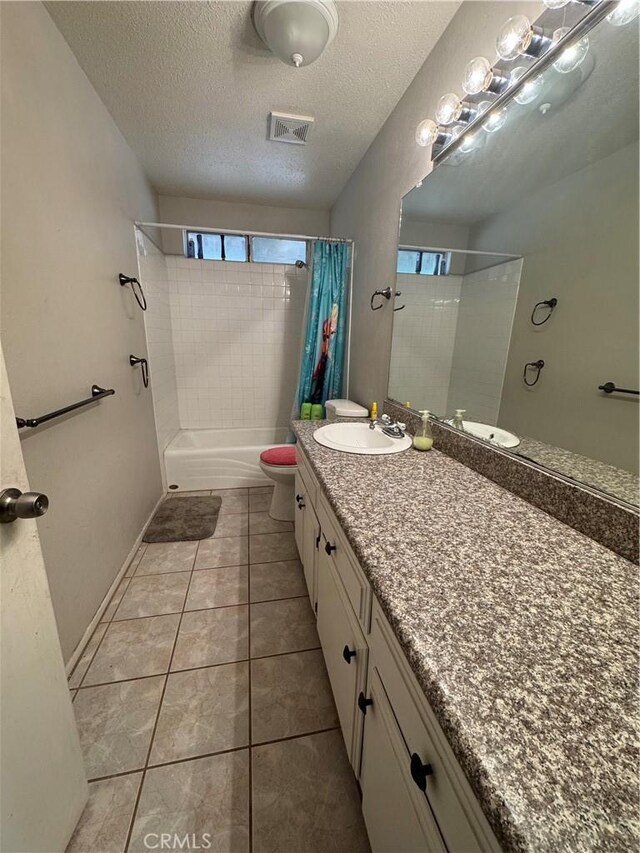 17665 Juniper St, Hesperia, CA 92345 - bathroom with a textured ceiling, tile patterned flooring, visible vents, toilet, and shower / tub combo with curtain