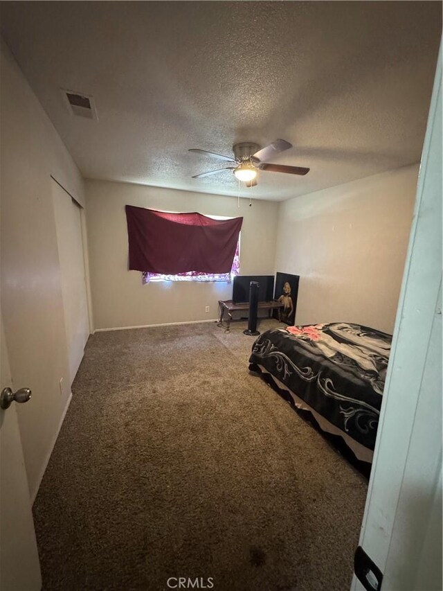 17665 Juniper St, Hesperia, CA 92345 - bedroom featuring visible vents, a ceiling fan, carpet floors, and a textured ceiling