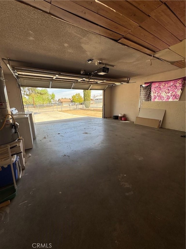 17665 Juniper St, Hesperia, CA 92345 - garage with washer and clothes dryer and a garage door opener