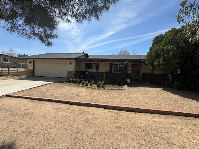 17665 Juniper St, Hesperia, CA 92345 - single story home with brick siding, driveway, fence, and a garage