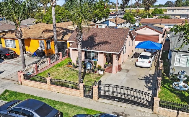 view of front of home with a residential view, stucco siding, a fenced front yard, a gate, and a shingled roof