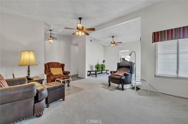 carpeted living room with lofted ceiling, a textured ceiling, and ceiling fan