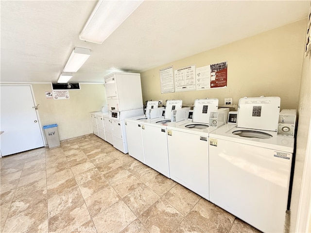 732 W Lambert Rd Unit 30, La Habra, CA 90631 - shared laundry area featuring stacked washer and dryer, washer and dryer, and stone finish flooring