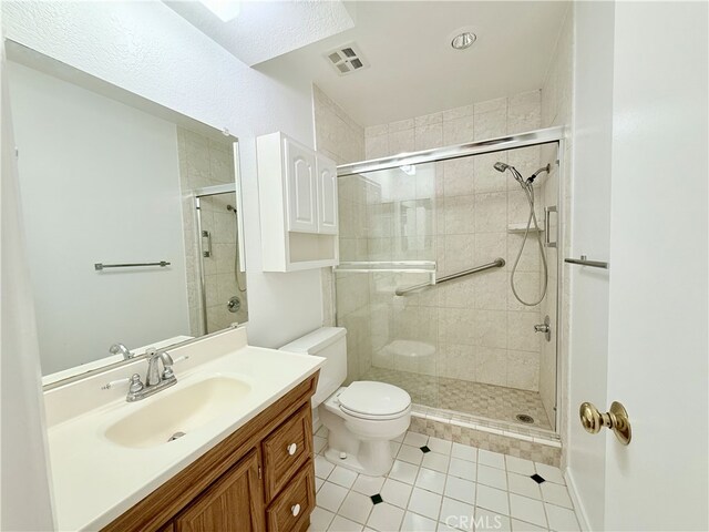 732 W Lambert Rd Unit 30, La Habra, CA 90631 - bathroom featuring vanity, tile patterned floors, toilet, a shower stall, and visible vents