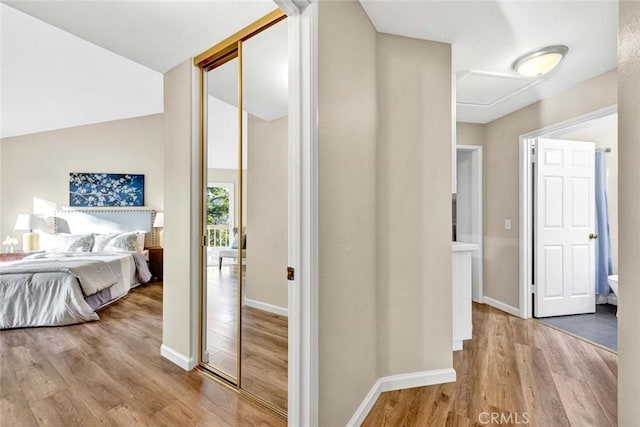 interior space with baseboards and wood finished floors