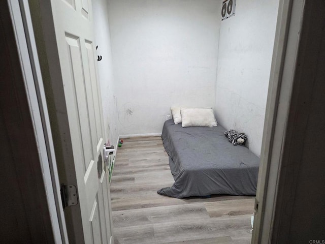 bedroom with wood finished floors