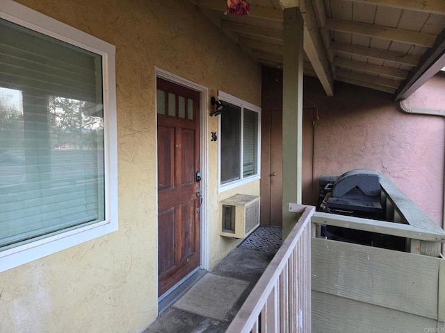 property entrance with stucco siding