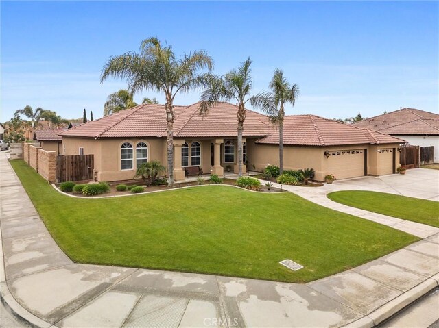 view of front of house featuring stucco siding, fence, an attached garage, and a tile roof