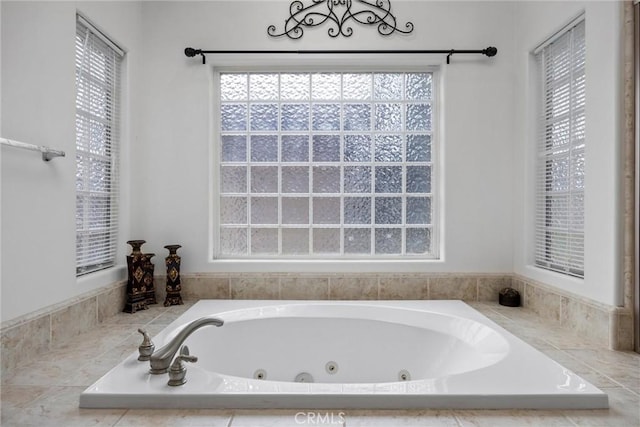 full bath featuring a tub with jets