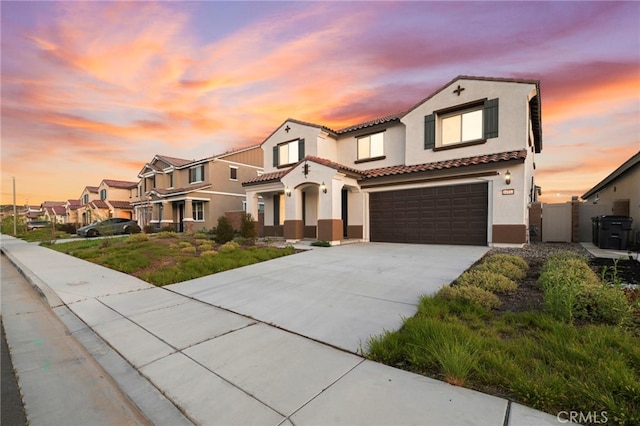29553 Tulipwood St, Menifee, CA 92584 - mediterranean / spanish-style home with a tiled roof, stucco siding, an attached garage, concrete driveway, and a residential view