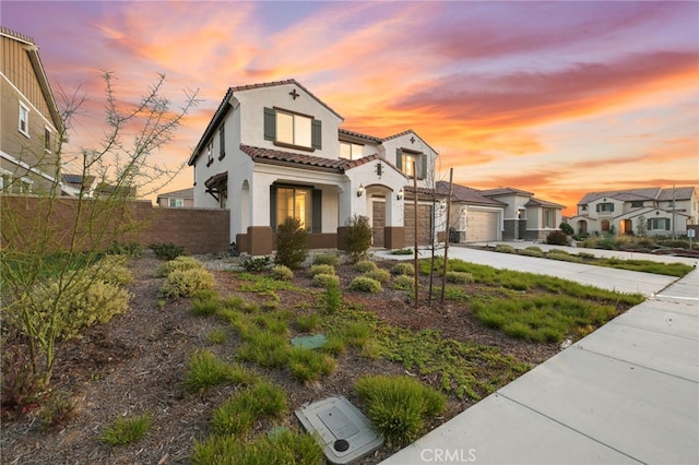 29553 Tulipwood St, Menifee, CA 92584 - mediterranean / spanish-style home featuring a tiled roof, a garage, stucco siding, fence, and concrete driveway