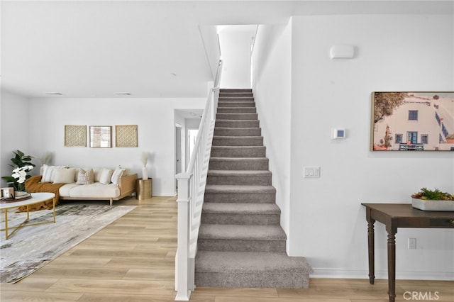 29553 Tulipwood St, Menifee, CA 92584 - stairs with baseboards and wood finished floors