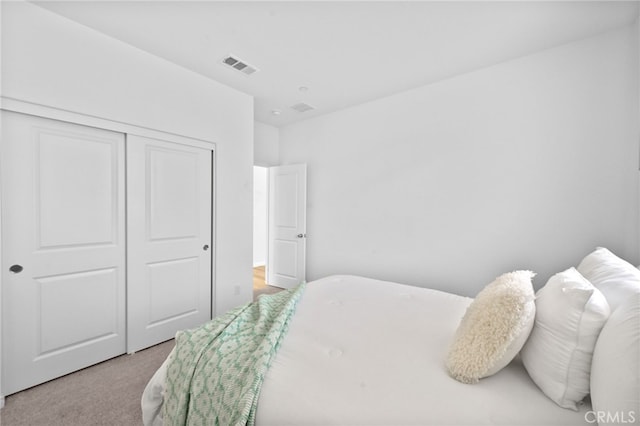 29553 Tulipwood St, Menifee, CA 92584 - bedroom with visible vents, a closet, and light carpet