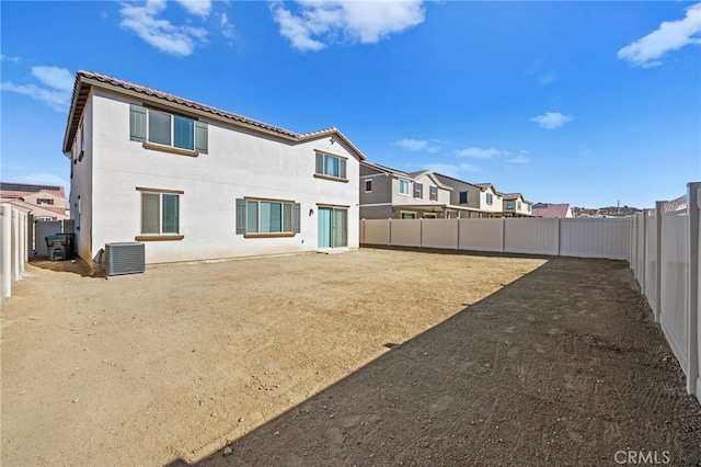 29553 Tulipwood St, Menifee, CA 92584 - rear view of property with cooling unit, stucco siding, and a fenced backyard