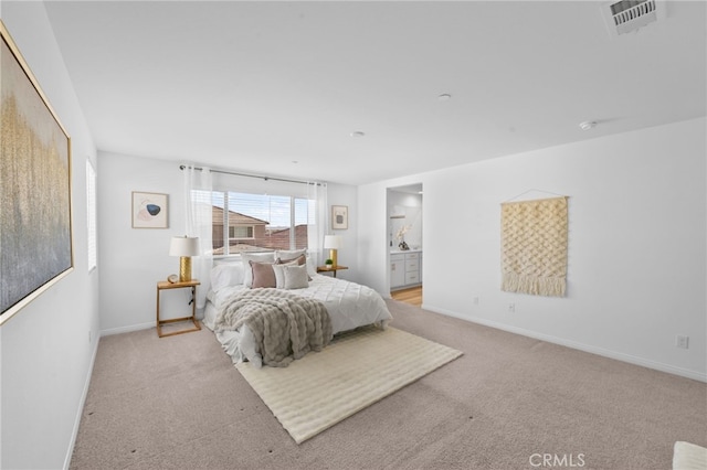 29553 Tulipwood St, Menifee, CA 92584 - bedroom featuring light carpet, baseboards, visible vents, and ensuite bath