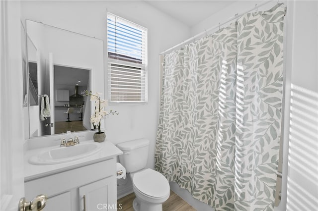 29553 Tulipwood St, Menifee, CA 92584 - bathroom with toilet, a shower with curtain, vanity, and wood finished floors