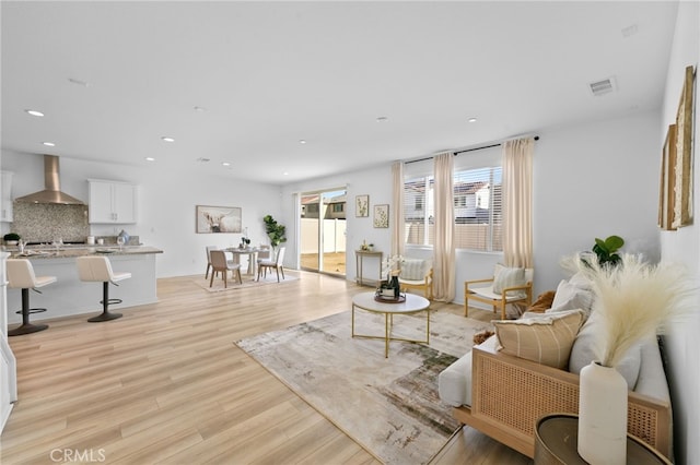 29553 Tulipwood St, Menifee, CA 92584 - living room with light wood-type flooring, visible vents, plenty of natural light, and recessed lighting