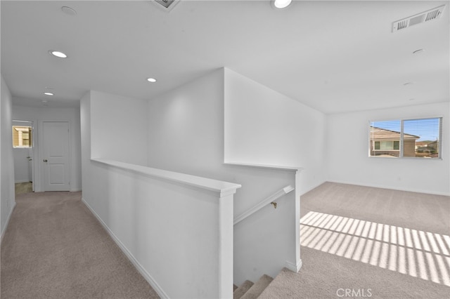 29553 Tulipwood St, Menifee, CA 92584 - hallway with carpet, visible vents, an upstairs landing, baseboards, and plenty of natural light