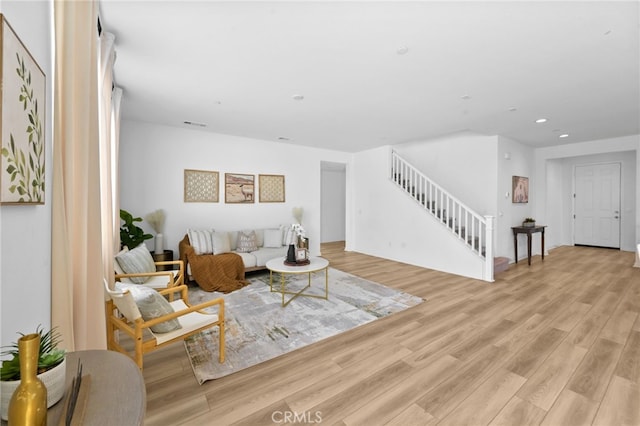 29553 Tulipwood St, Menifee, CA 92584 - living room featuring visible vents, stairway, recessed lighting, and light wood finished floors