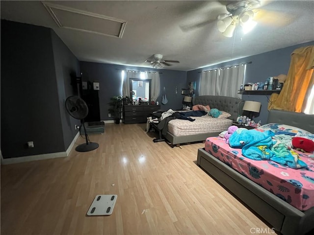 664 W 14th St, San Bernardino, CA 92405 - bedroom featuring a ceiling fan, attic access, and wood finished floors