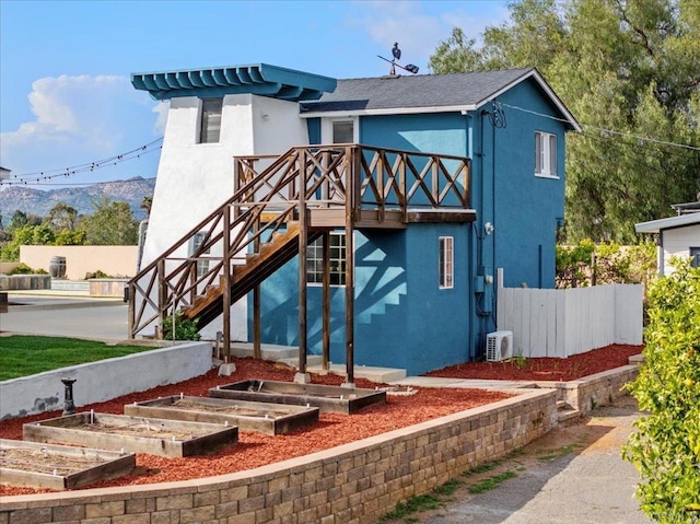 1420 Idaho Ave, Escondido, CA 92027 - back of property featuring stucco siding, a deck, a garden, and stairs