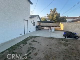 view of patio / terrace featuring fence