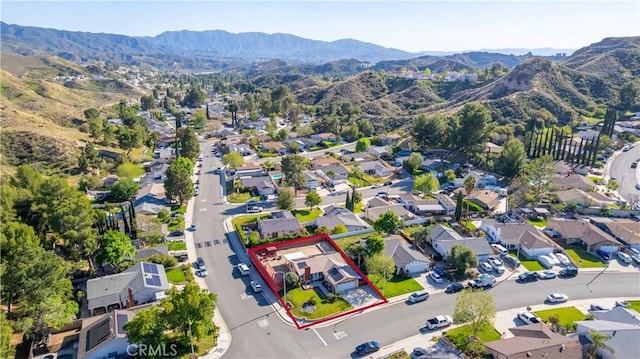 aerial view featuring a mountain view and a residential view