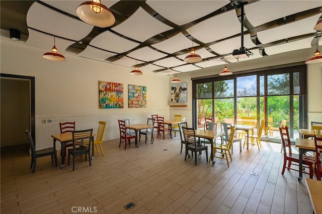 dining area featuring wainscoting