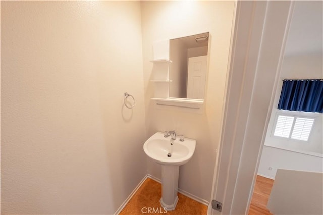 bathroom featuring baseboards