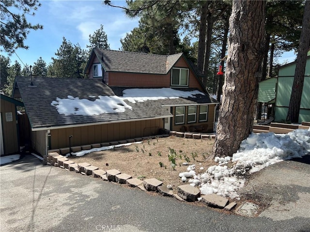 31671 Silver Spruce Dr, Running Springs, CA 92382 - view of property exterior with roof with shingles