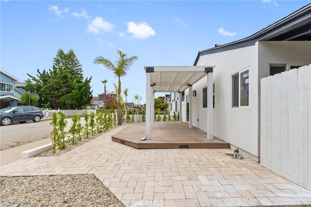 view of patio / terrace featuring fence