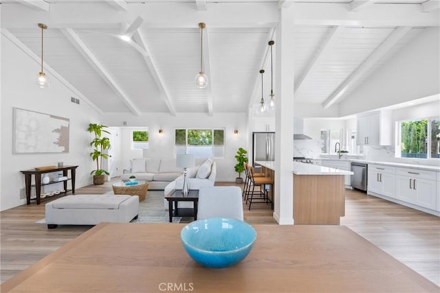 5121 Beachcomber St, Oxnard, CA 93035 - dining space with light wood-style flooring, high vaulted ceiling, healthy amount of natural light, beam ceiling, and wooden ceiling