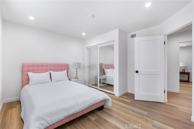 5121 Beachcomber St, Oxnard, CA 93035 - bedroom with a closet, baseboards, recessed lighting, and light wood-style flooring