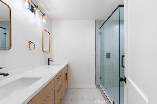 full bath with a shower stall, tile patterned flooring, and double vanity