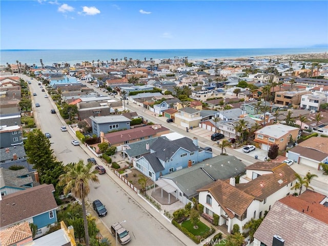 aerial view of residential area with a nearby body of water