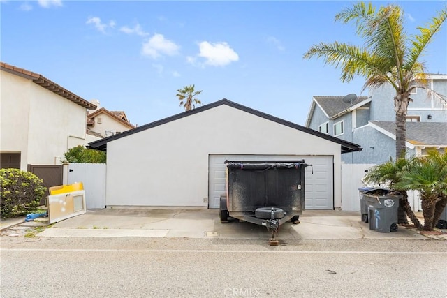 garage with concrete driveway