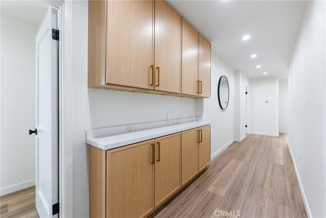 5121 Beachcomber St, Oxnard, CA 93035 - kitchen with light wood-type flooring, light countertops, recessed lighting, light brown cabinets, and baseboards