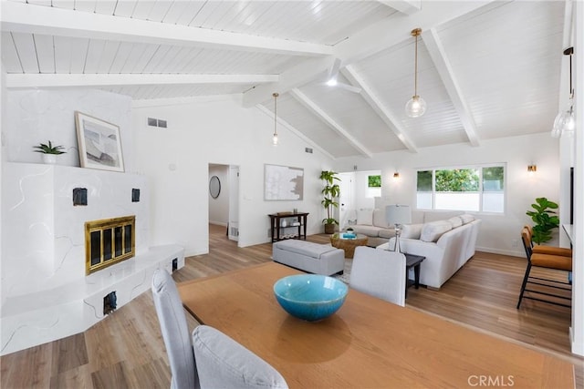 5121 Beachcomber St, Oxnard, CA 93035 - living room with light wood-style flooring, a high end fireplace, wood ceiling, and baseboards