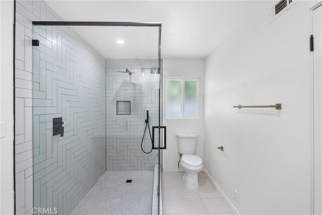 5121 Beachcomber St, Oxnard, CA 93035 - full bathroom with toilet, a stall shower, tile patterned floors, and baseboards