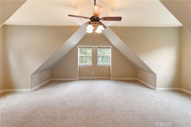 additional living space with lofted ceiling, ceiling fan, baseboards, and carpet floors