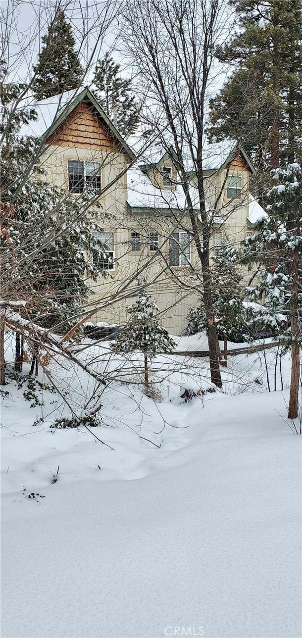 view of snow covered property