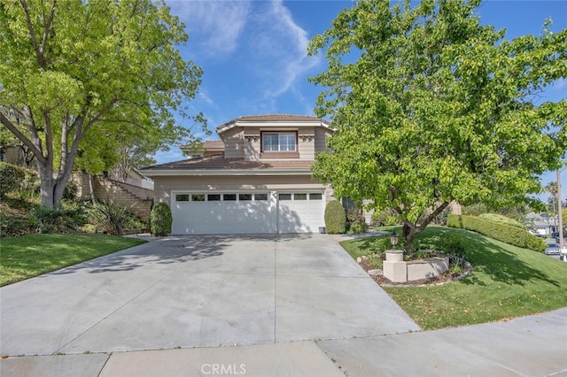view of front of property with a front yard, stairs, a garage, and concrete driveway