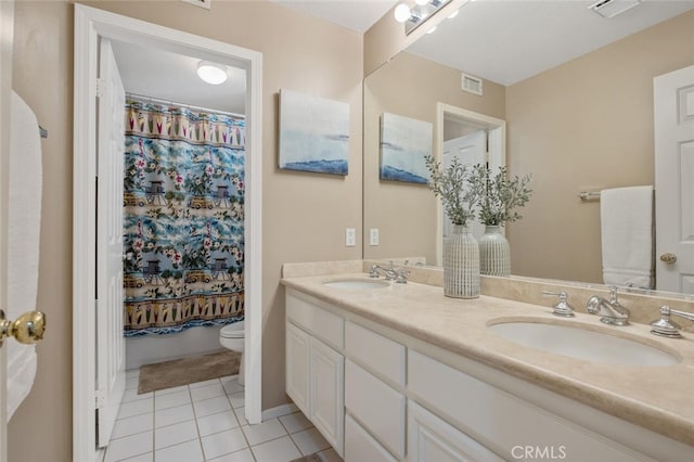 full bathroom featuring visible vents, a sink, toilet, double vanity, and tile patterned flooring