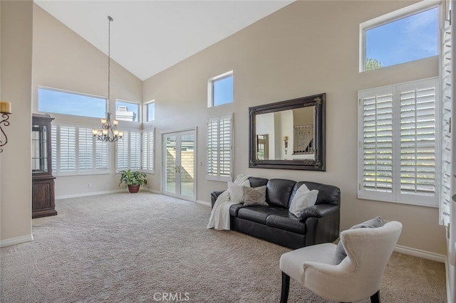 27448 Whitefield Pl, Valencia, CA 91354 - carpeted living room with high vaulted ceiling, a chandelier, and baseboards
