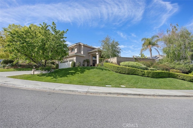 obstructed view of property featuring a front yard and an attached garage
