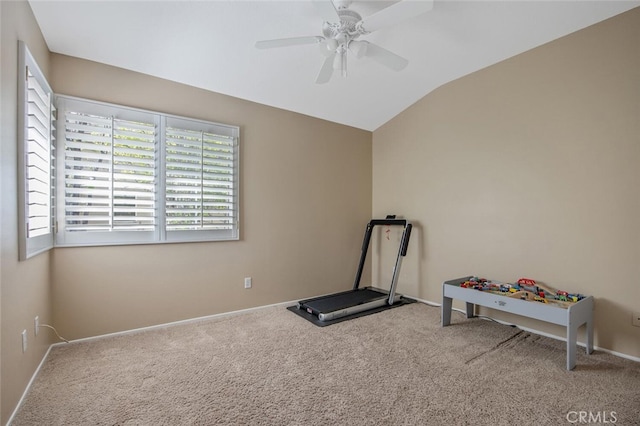 exercise room with carpet, baseboards, a ceiling fan, and lofted ceiling